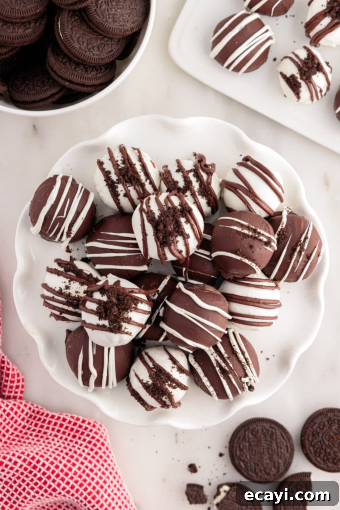 Decadent Oreo Truffles 5 Oreo Truffles stacked on a white serving tray, ready to be enjoyed
