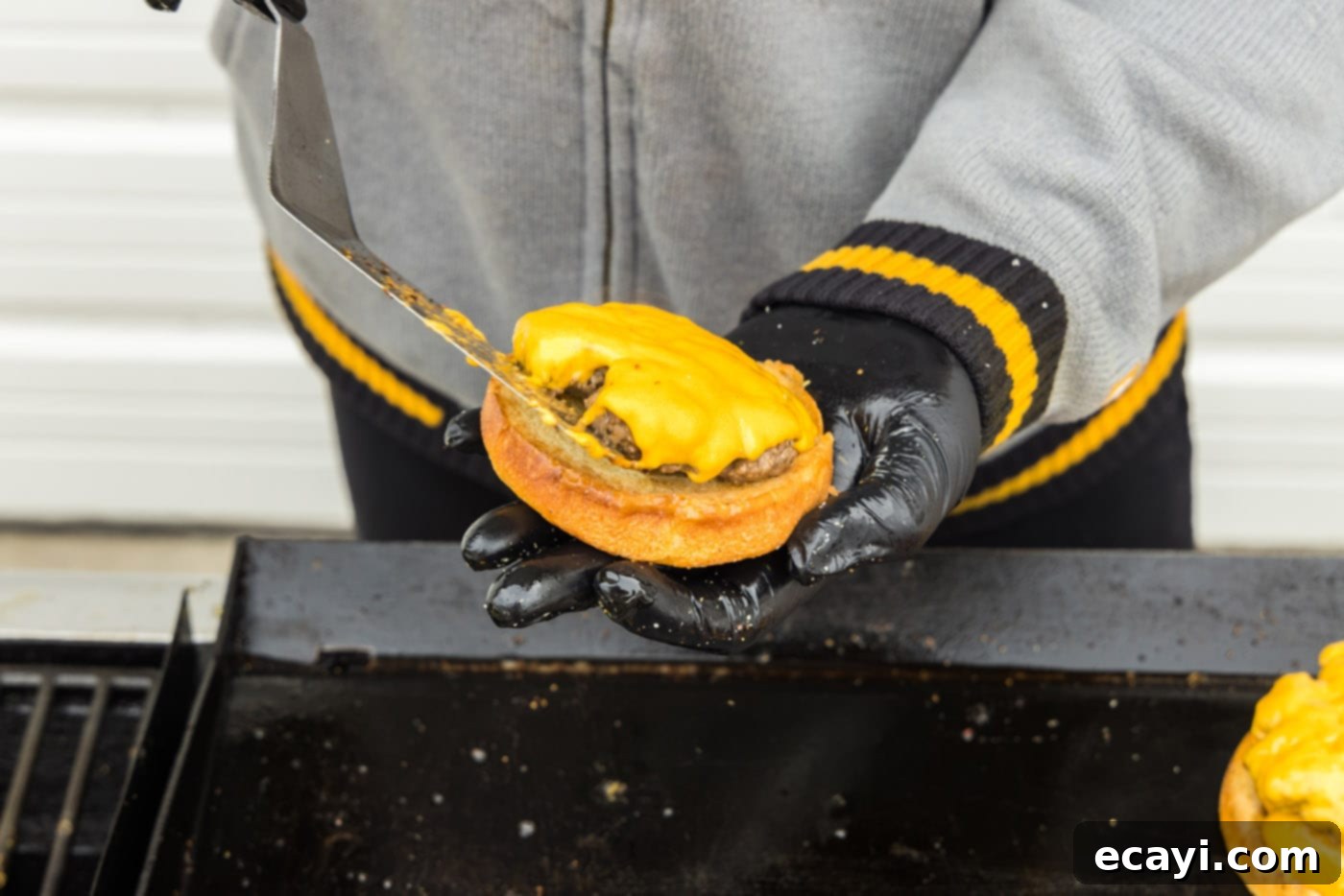 The Smash Burger 14 adding burger patty with cheese to a bun