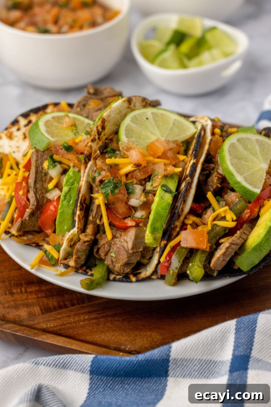 Sizzling Steak Fajitas 14 Steak Fajitas wrapped in tortillas served on a plate