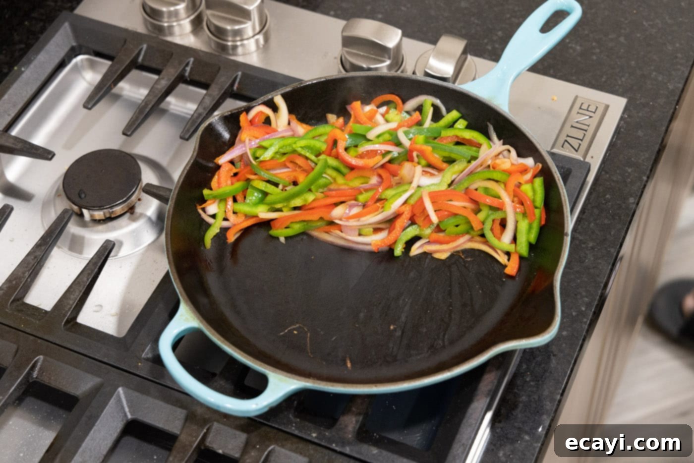 Sizzling Steak Fajitas 10 fajita veggies on one side of skillet