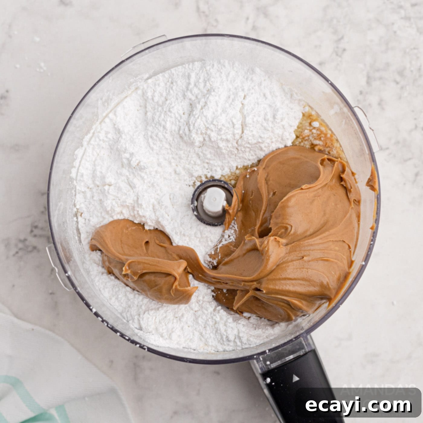 Peanut Butter Dream Bars 5 peanut butter bar ingredients being combined in a food processor