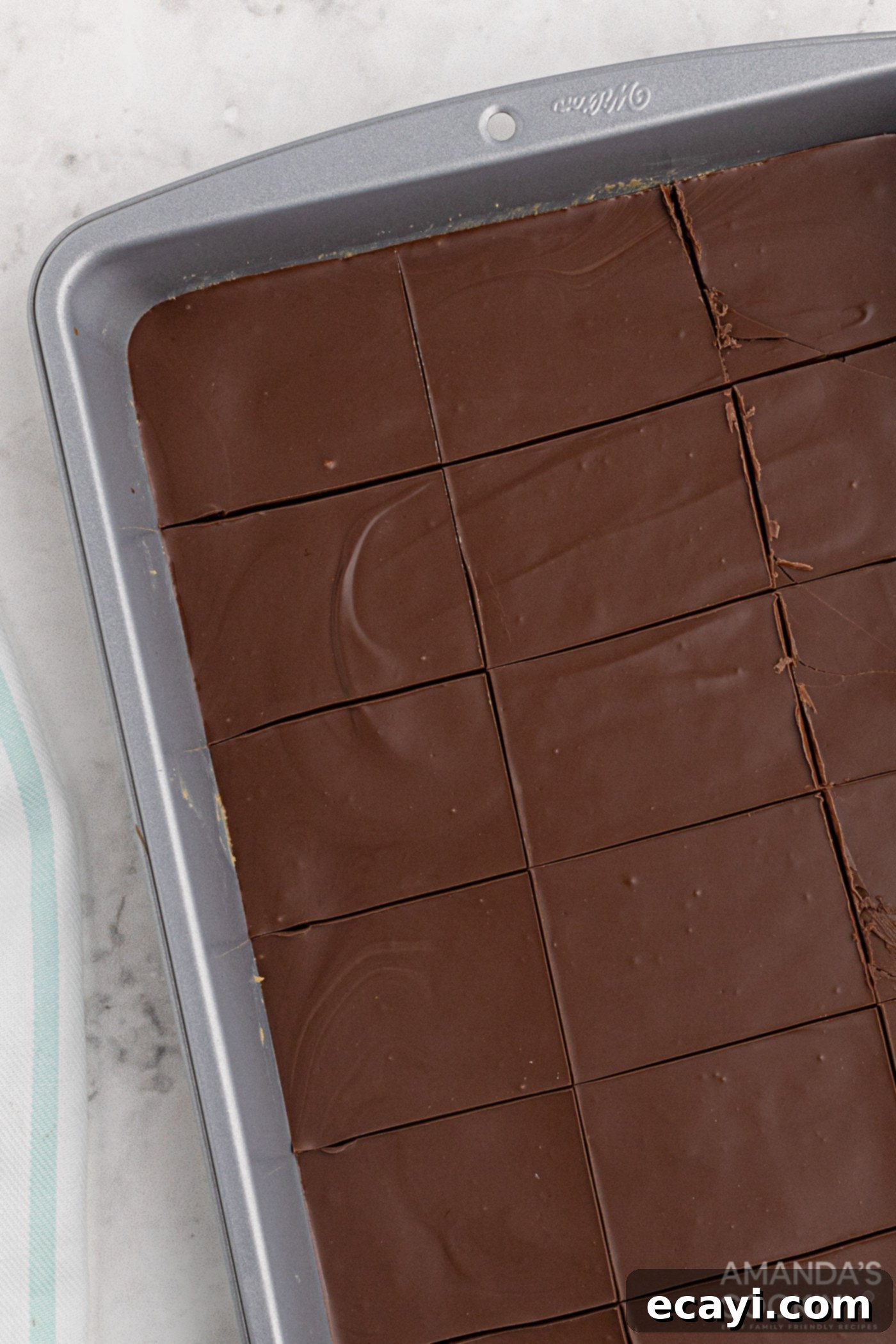 Peanut Butter Dream Bars 7 firm peanut butter bars in a pan, ready for cutting