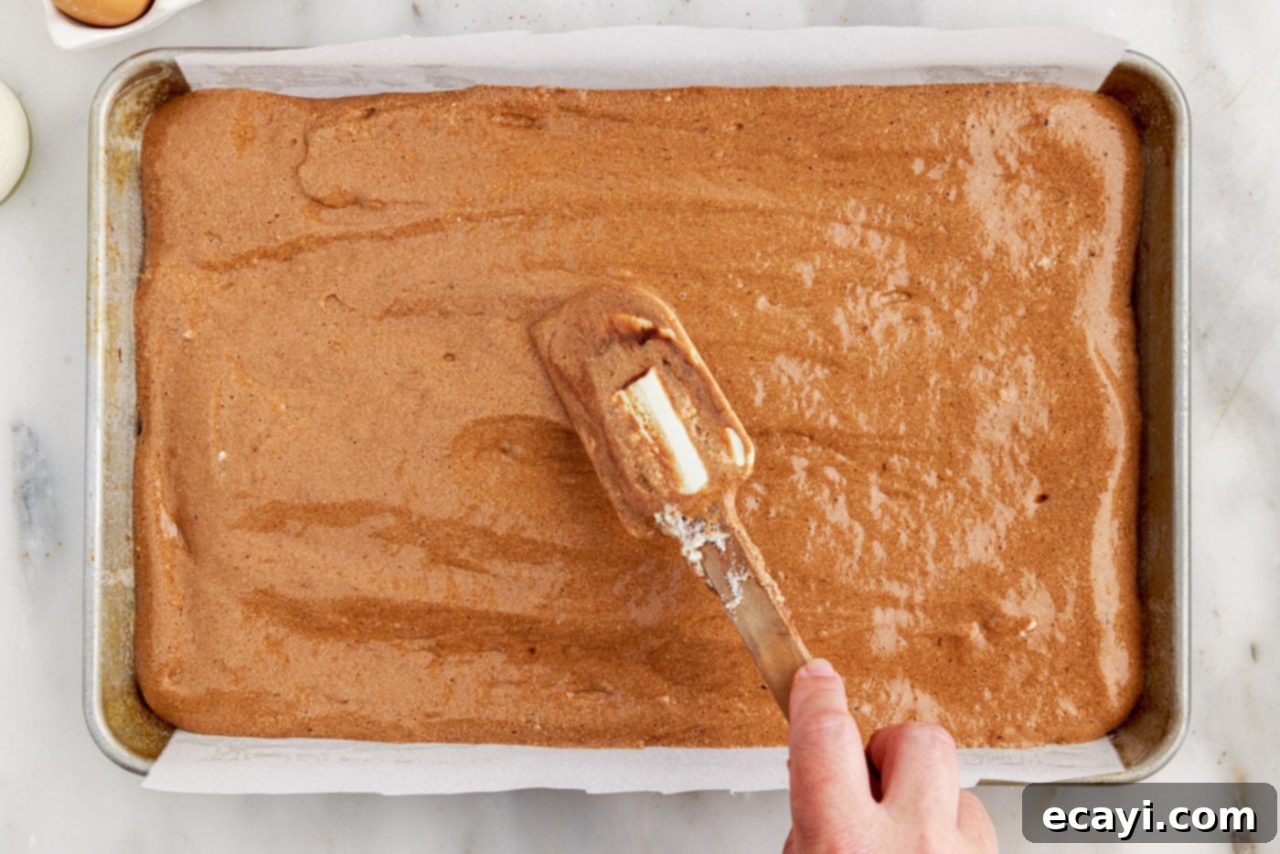 Velvet Chocolate Swirl 12 swiss log cake batter in a jelly roll pan