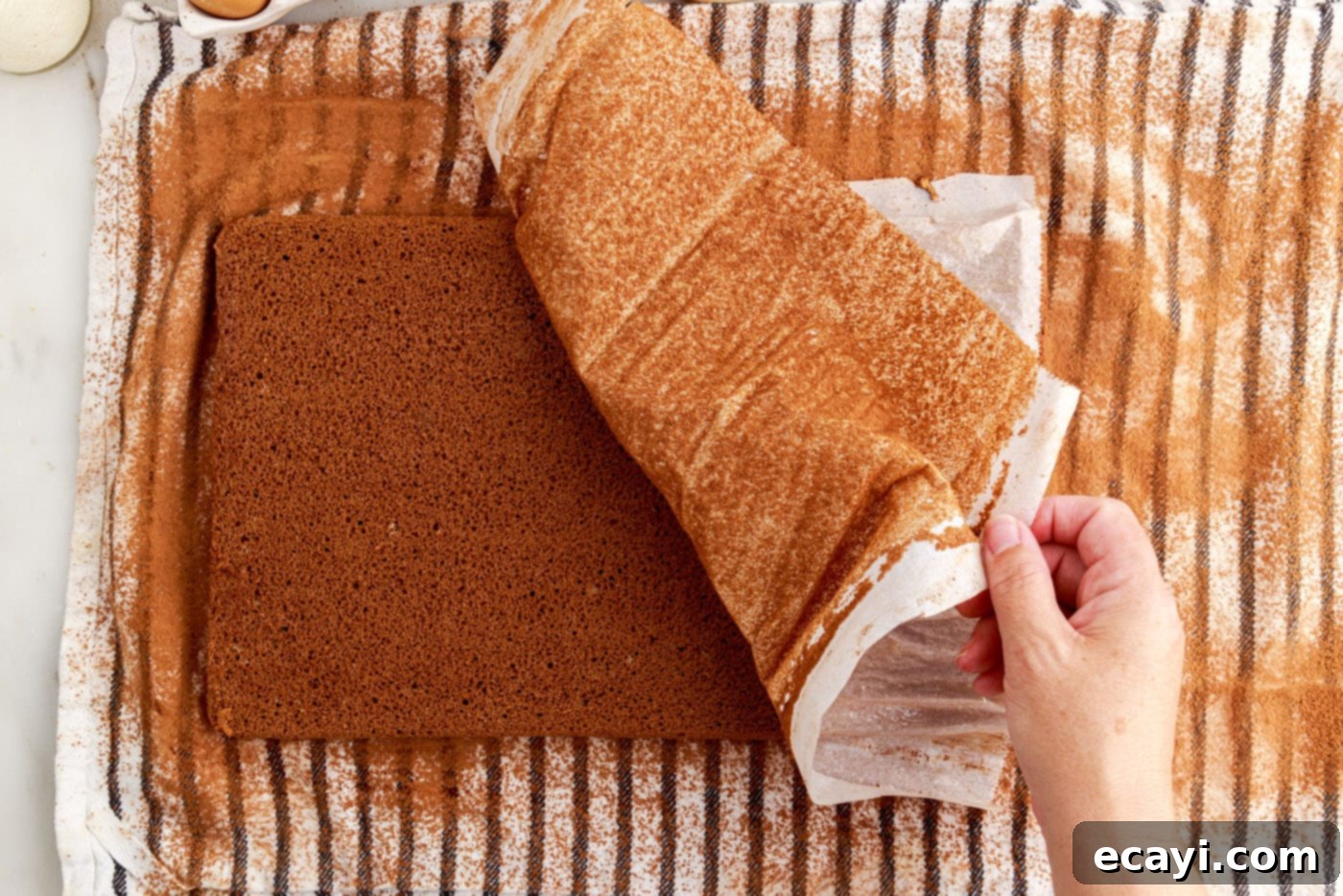 Velvet Chocolate Swirl 15 placing jelly roll cake onto towel