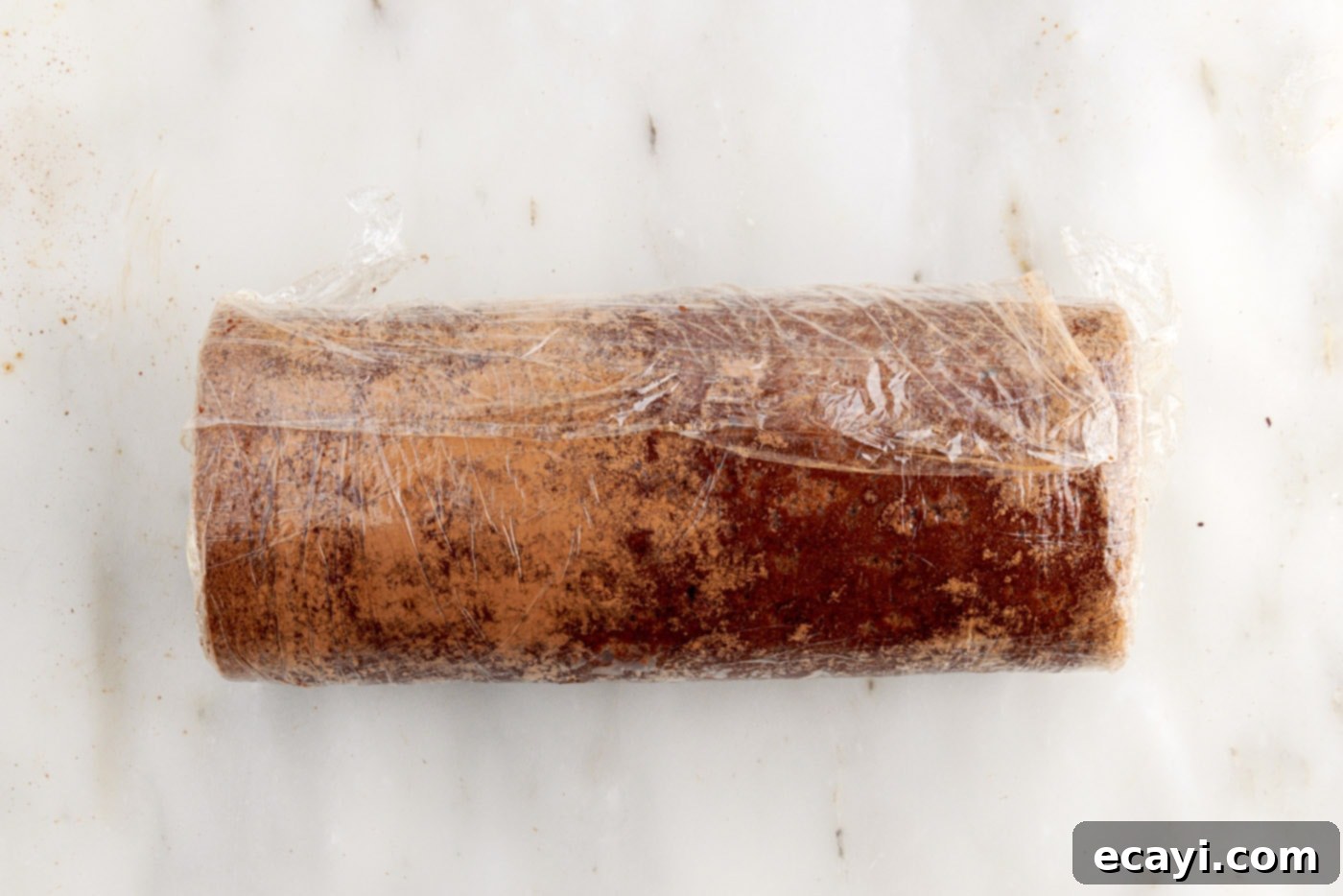 Velvet Chocolate Swirl 23 swiss roll wrapped in plastic wrap