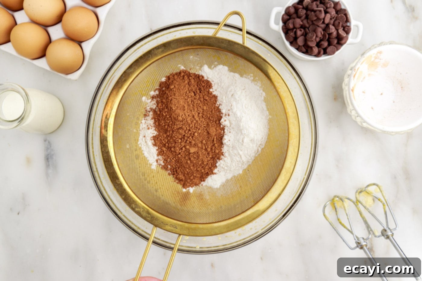 Velvet Chocolate Swirl 8 sifting cocoa powder and cake flour into a bowl