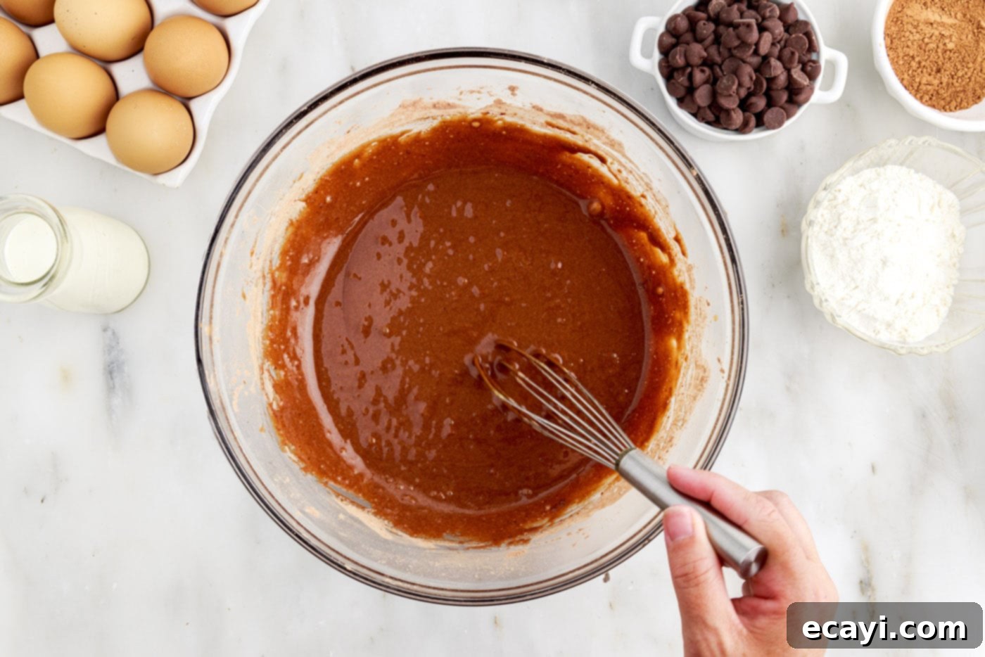 Velvet Chocolate Swirl 9 whisking chocolate cake batter in a bowl