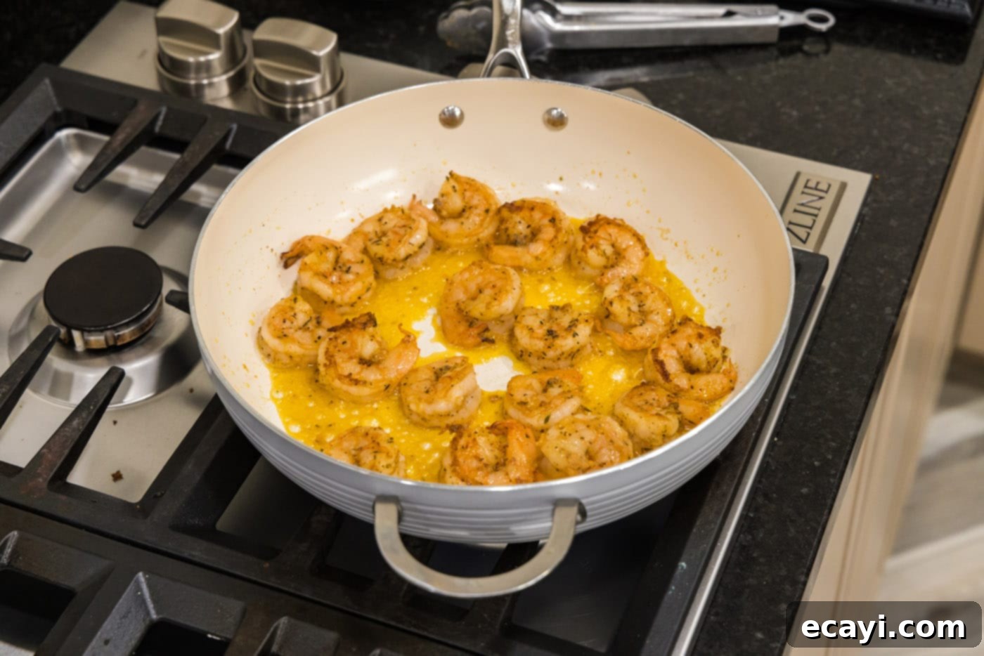 Creamy Cajun Shrimp Pasta 7 Perfectly cooked, pink shrimp shown in a skillet, indicating they are ready to be removed.