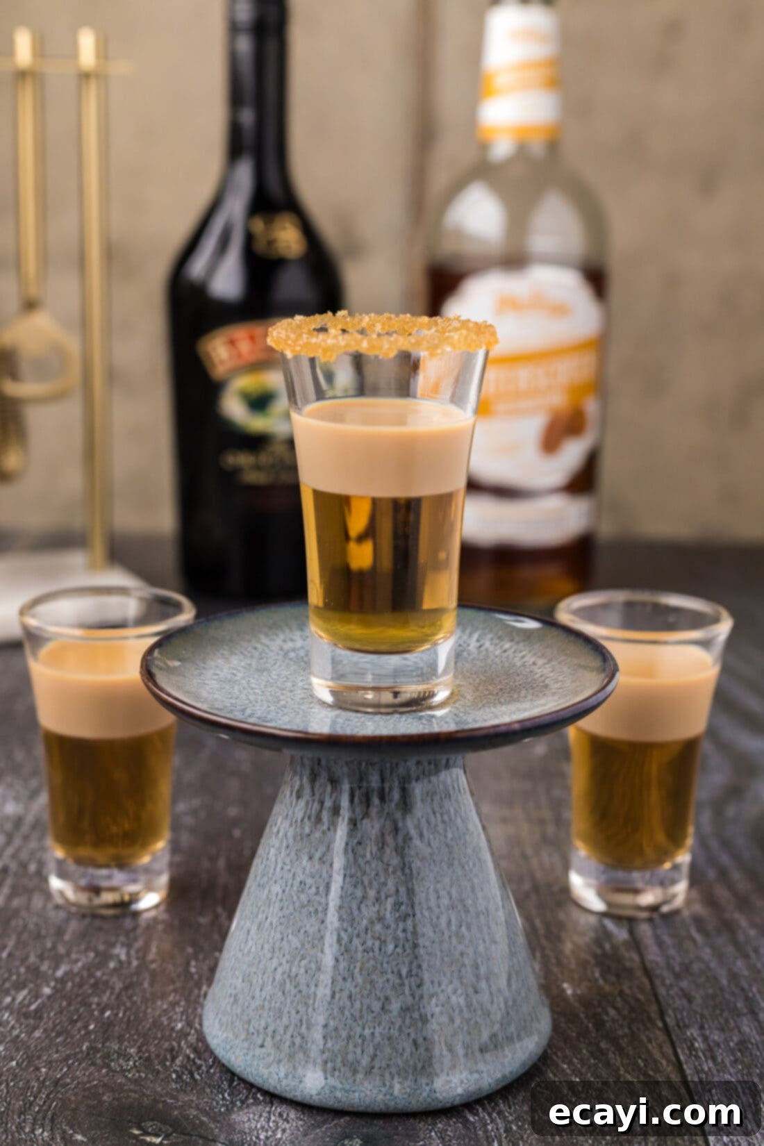 Buttery Nipple Bliss 3 A Buttery Nipple Shot resting on a cupcake stand, ready to be enjoyed