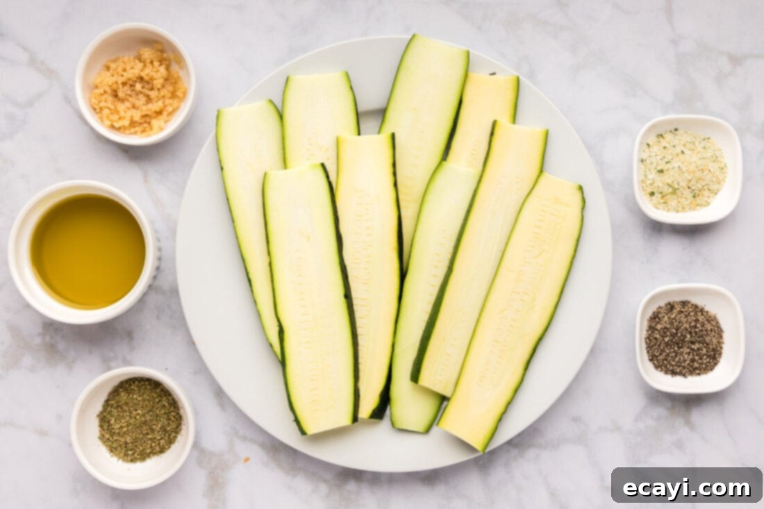 Smoky Zucchini Perfection 4 Fresh zucchini, whole garlic cloves, olive oil, and a selection of dried herbs, laid out as ingredients for grilled zucchini.