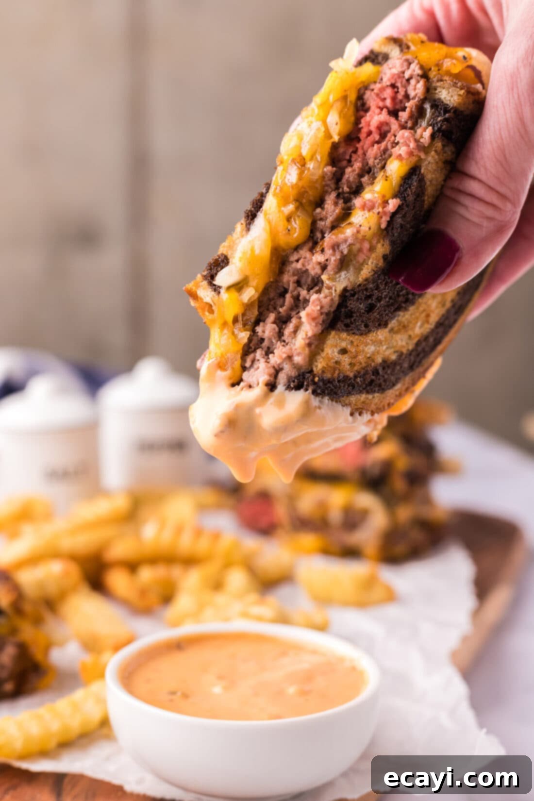 Patty Melt 3 Patty Melt dipped in sauce