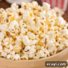 Irresistible Sweet & Salty Crunch 12 Close-up of golden, sweet and salty kettle corn in a white bowl