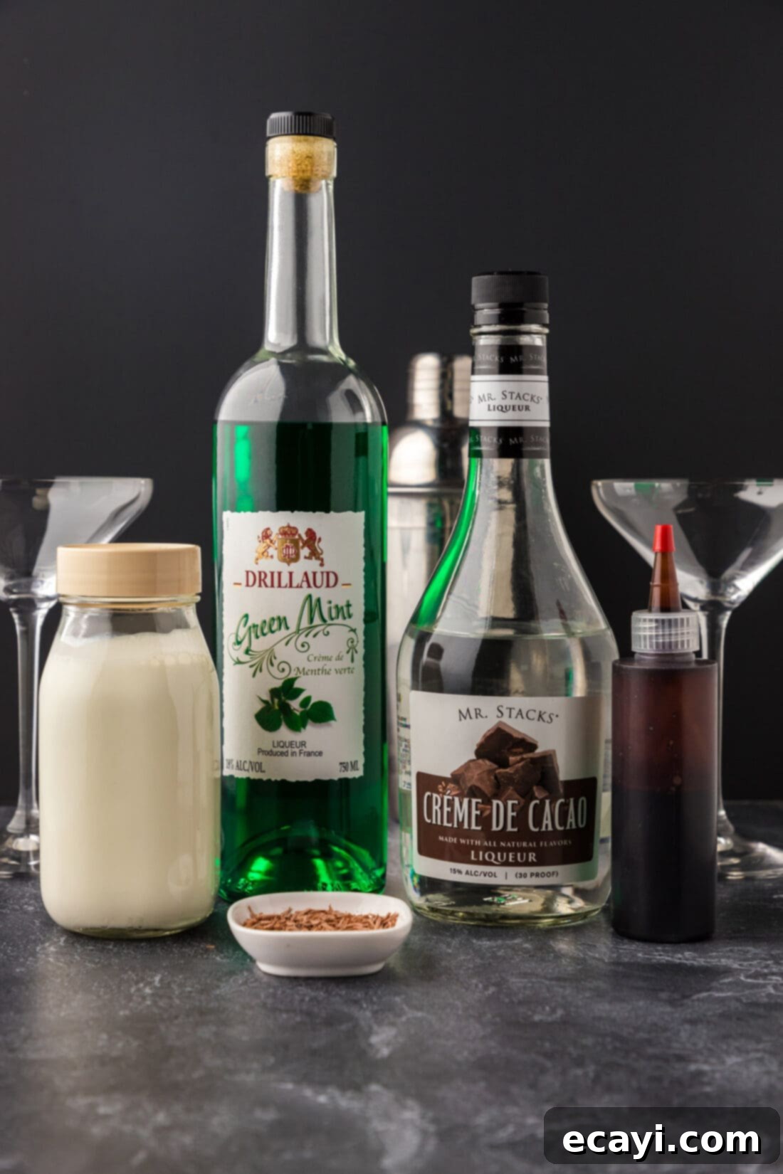 Velvet Grasshopper 4 The three main ingredients laid out for a Grasshopper Drink: creme de cacao, creme de menthe, and heavy cream