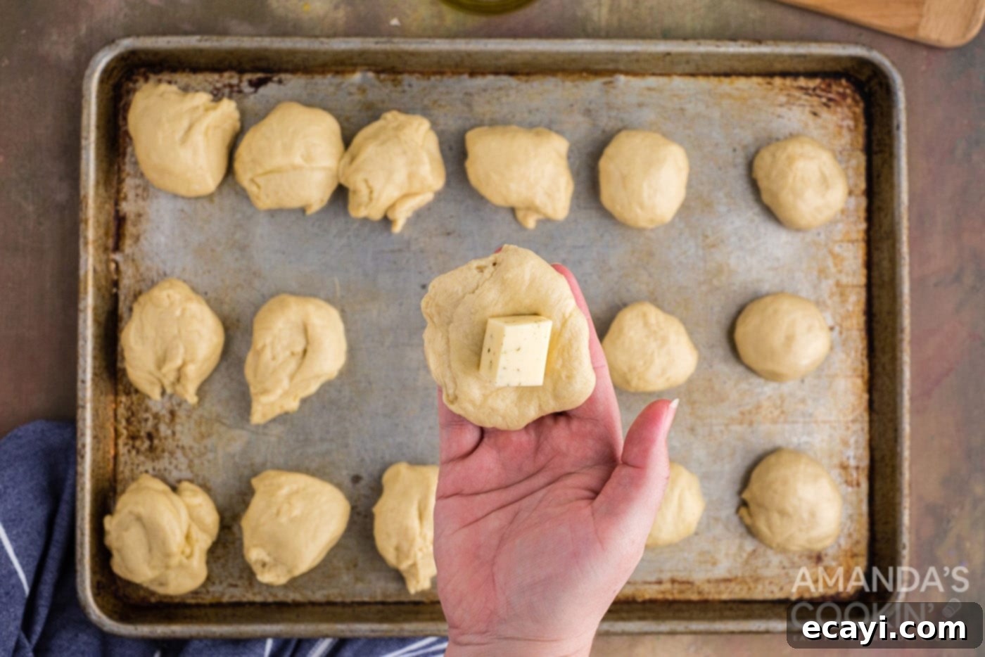 Golden Cheesy Garlic Buns 10 adding cheese to dough