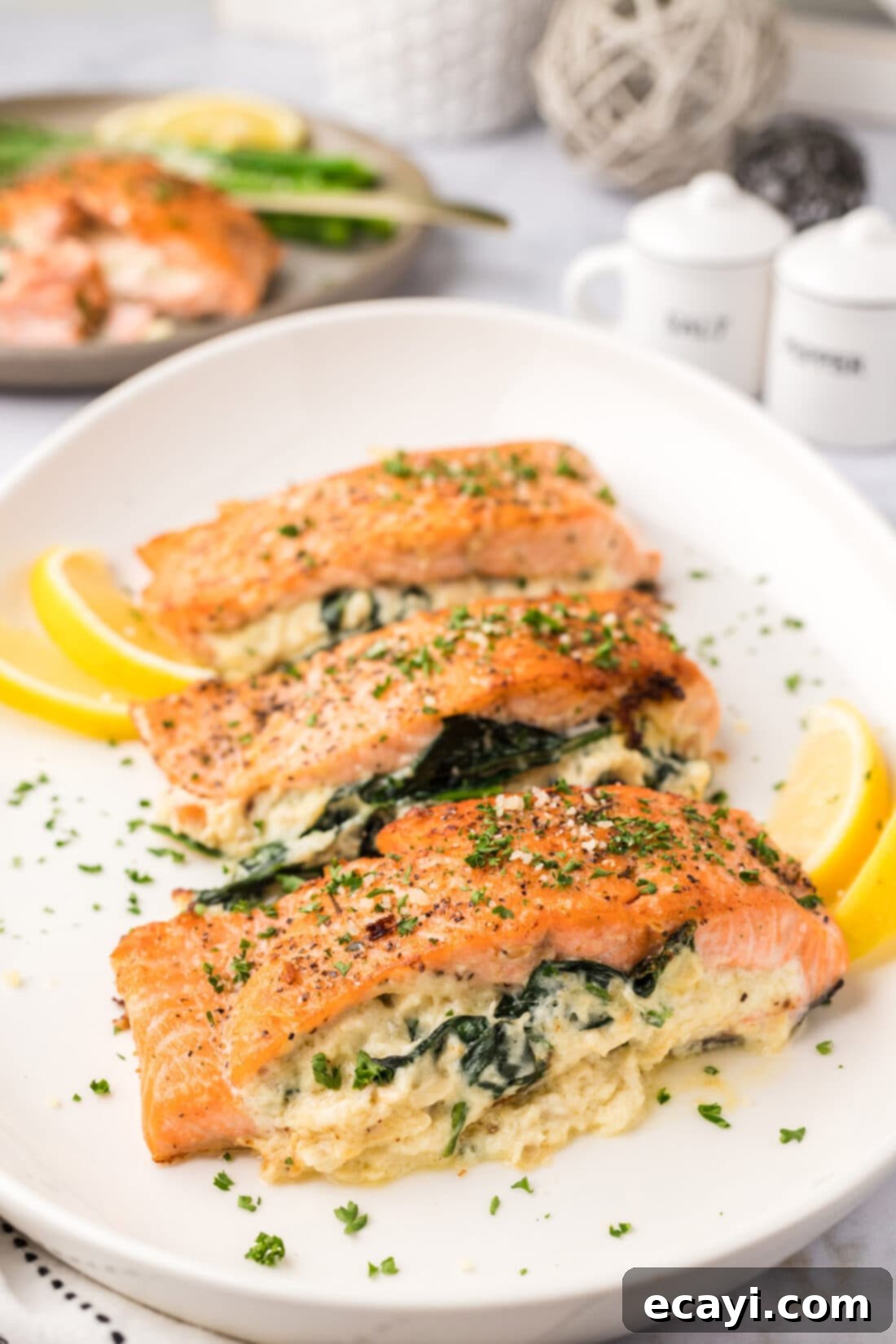 Gourmet Stuffed Salmon 2 Stuffed Salmon on a white platter with lemons
