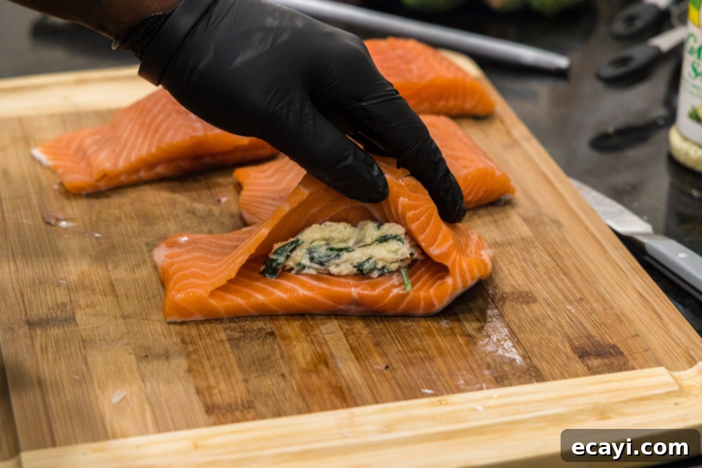 Gourmet Stuffed Salmon 16 adding stuffing to salmon pocket