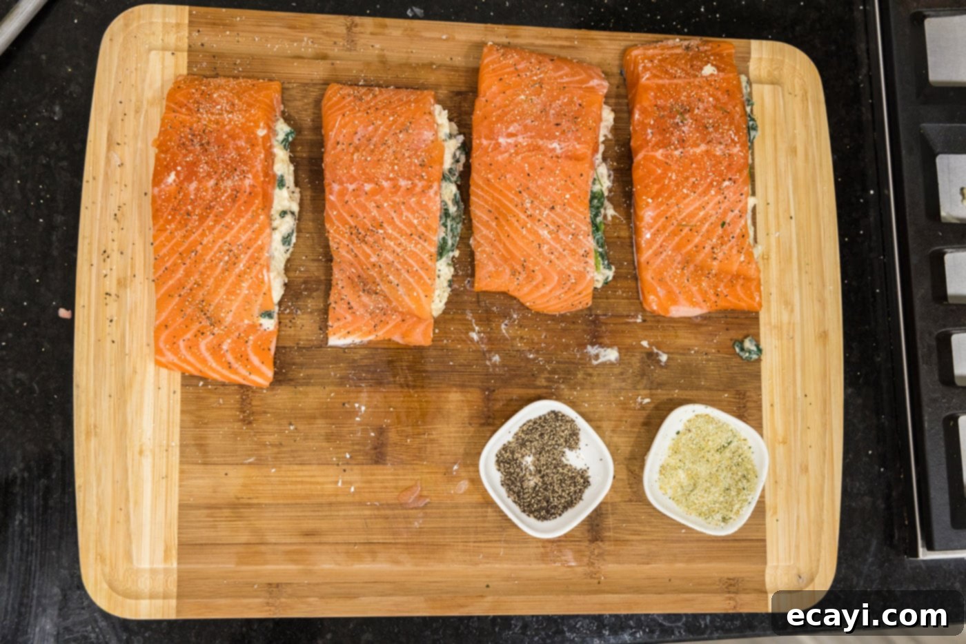 Gourmet Stuffed Salmon 18 stuffed salmon filets on a cutting board