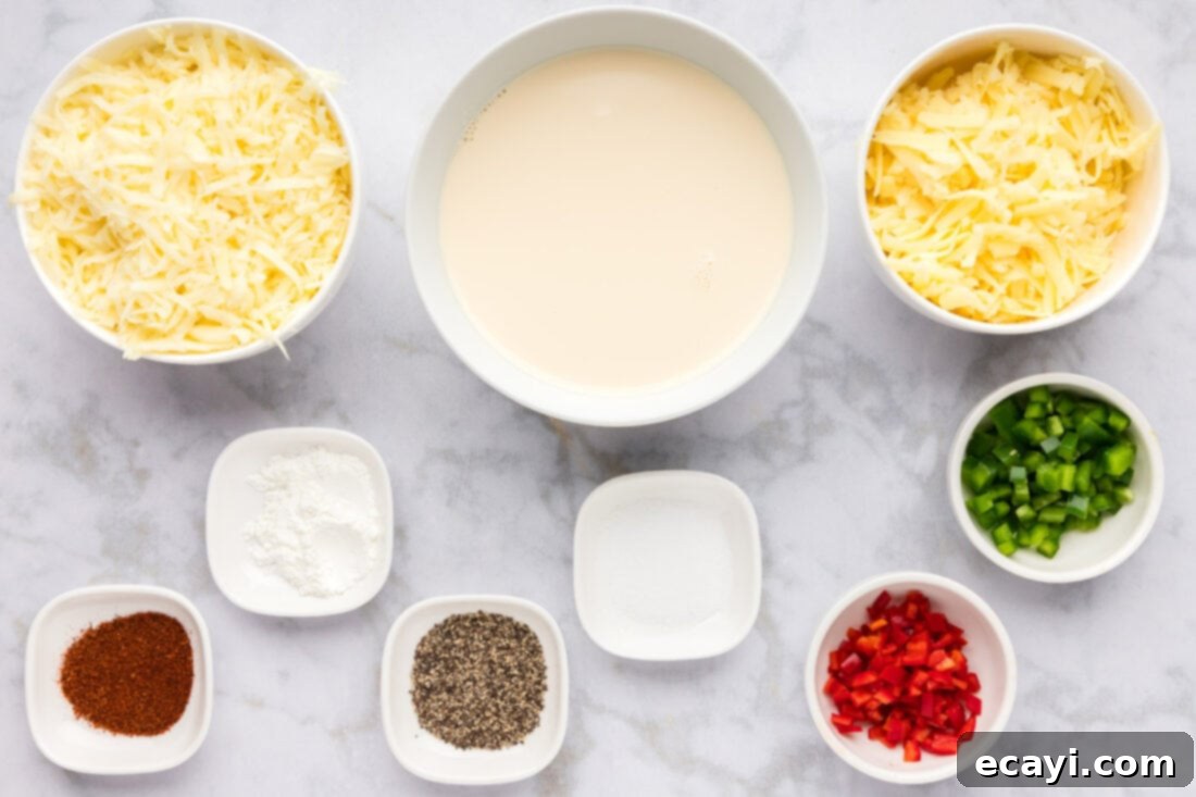 Creamy Queso 4 Assorted ingredients for making creamy white queso dip, including shredded cheeses, evaporated milk, and peppers