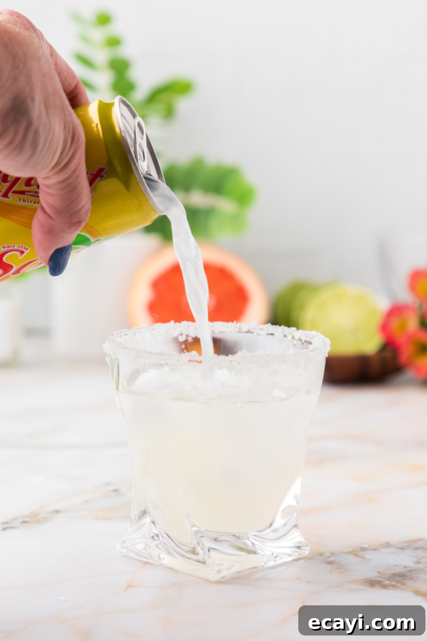 Paloma 10 adding grapefruit soda to lime juice and tequila