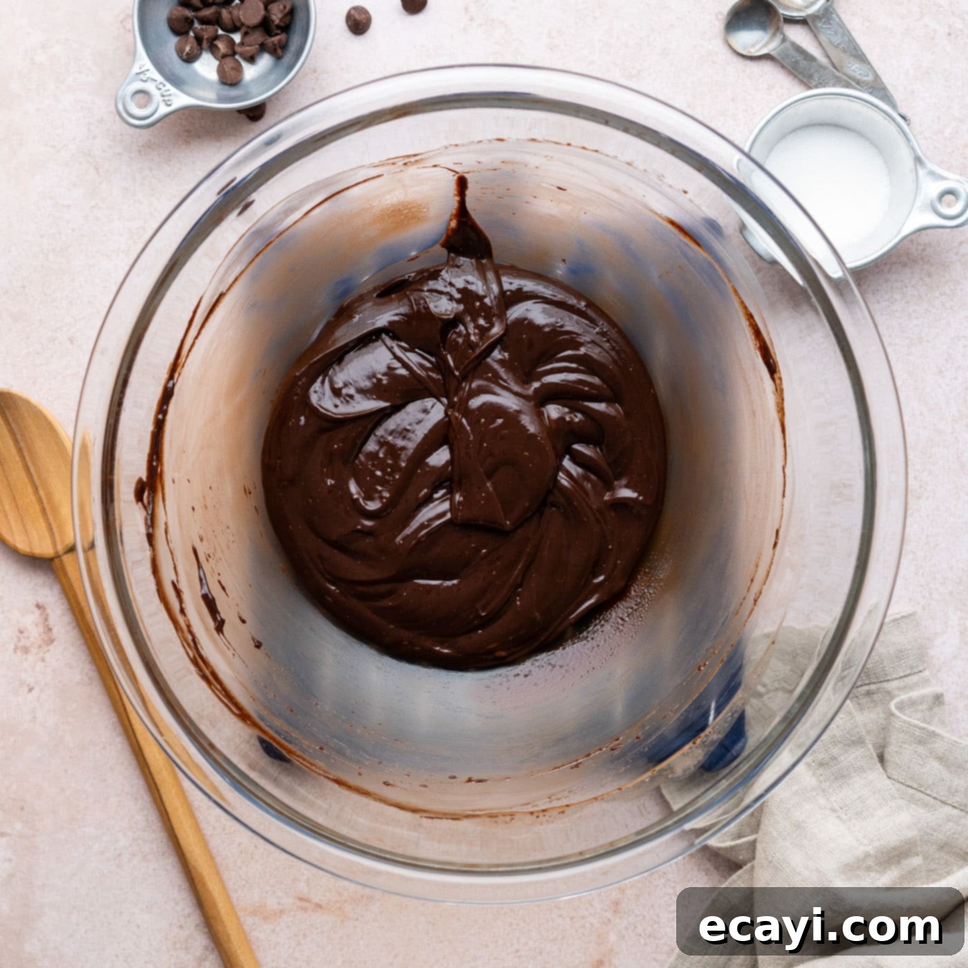 Decadent Millionaire Brownies 18 Smooth and glossy chocolate ganache in a bowl after being heated and whisked.