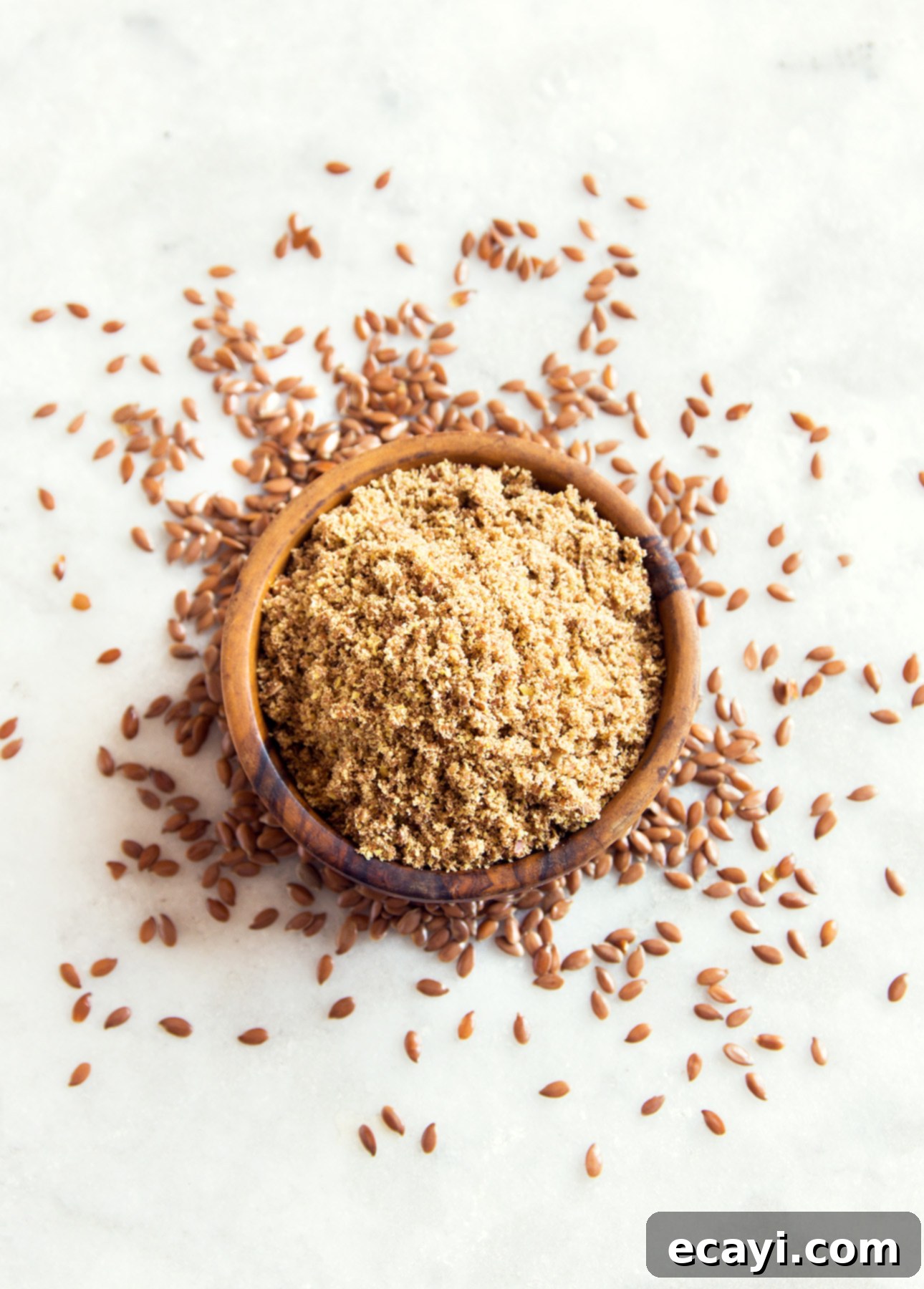 Aromatic Cumin & Caramelized Onion Quiche 5 Whole and ground flax seeds on marble background // FoodNouveau.com