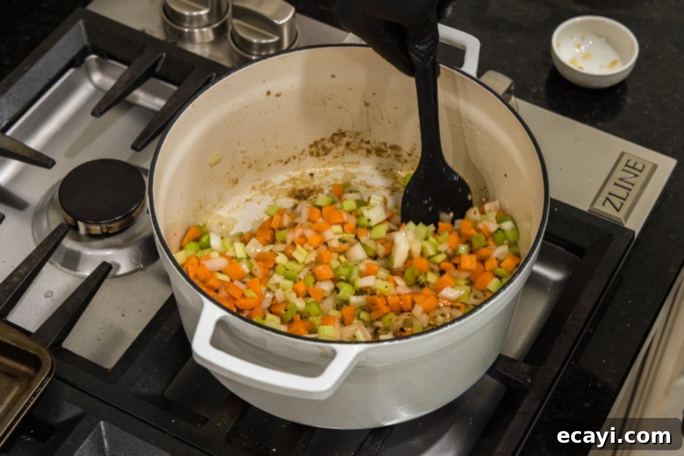 Melt-in-Your-Mouth Braised Beef Shanks 12 Stirring the sautéing vegetables in the Dutch oven to combine flavors