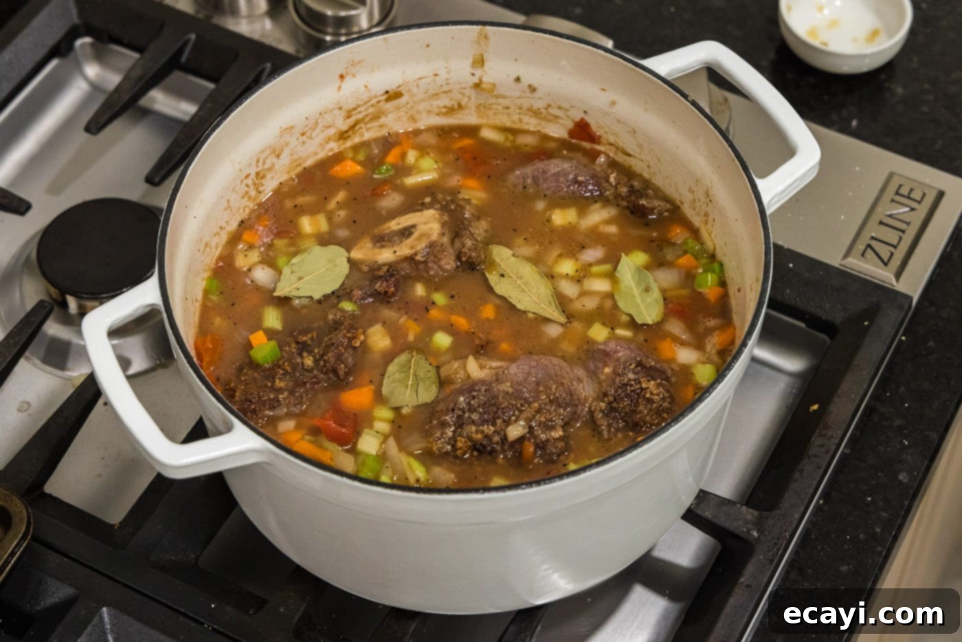 Melt-in-Your-Mouth Braised Beef Shanks 18 Bay leaves added to the braised beef shanks mixture in the Dutch oven before baking