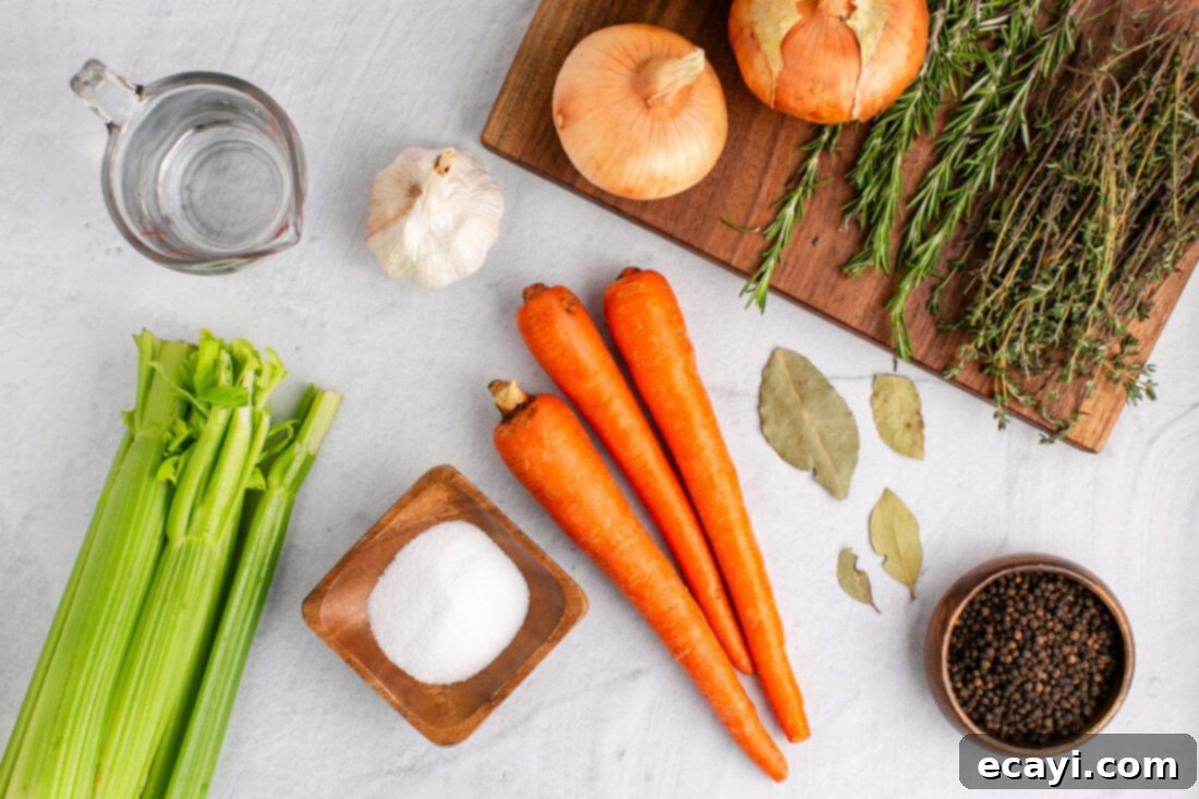 Garden Elixir 4 A collection of fresh ingredients laid out for making vegetable broth, including celery, carrots, onions, garlic, thyme, rosemary, and bay leaves