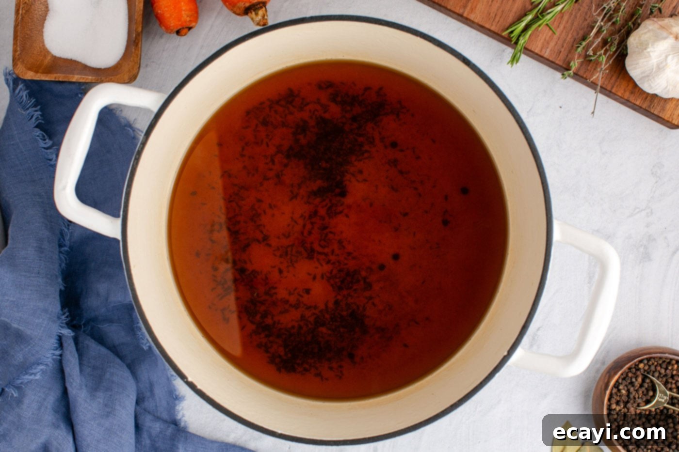 Garden Elixir 10 A clean stockpot filled with the strained, golden homemade vegetable broth, ready for cooling and storage