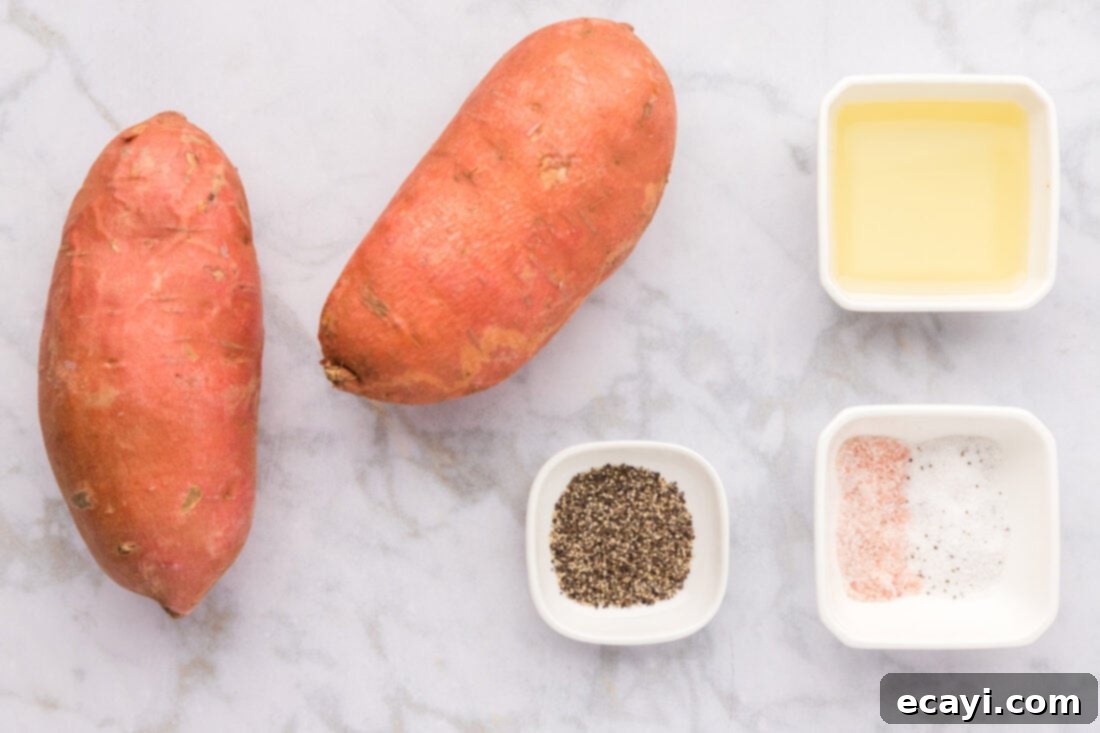 Perfectly Crispy Air Fryer Sweet Potato Fries 4 Ingredients for Air Fryer Sweet Potato Fries laid out on a cutting board