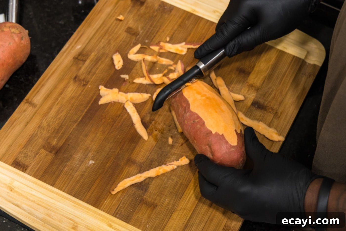 Perfectly Crispy Air Fryer Sweet Potato Fries 5 Peeling sweet potatoes with a vegetable peeler