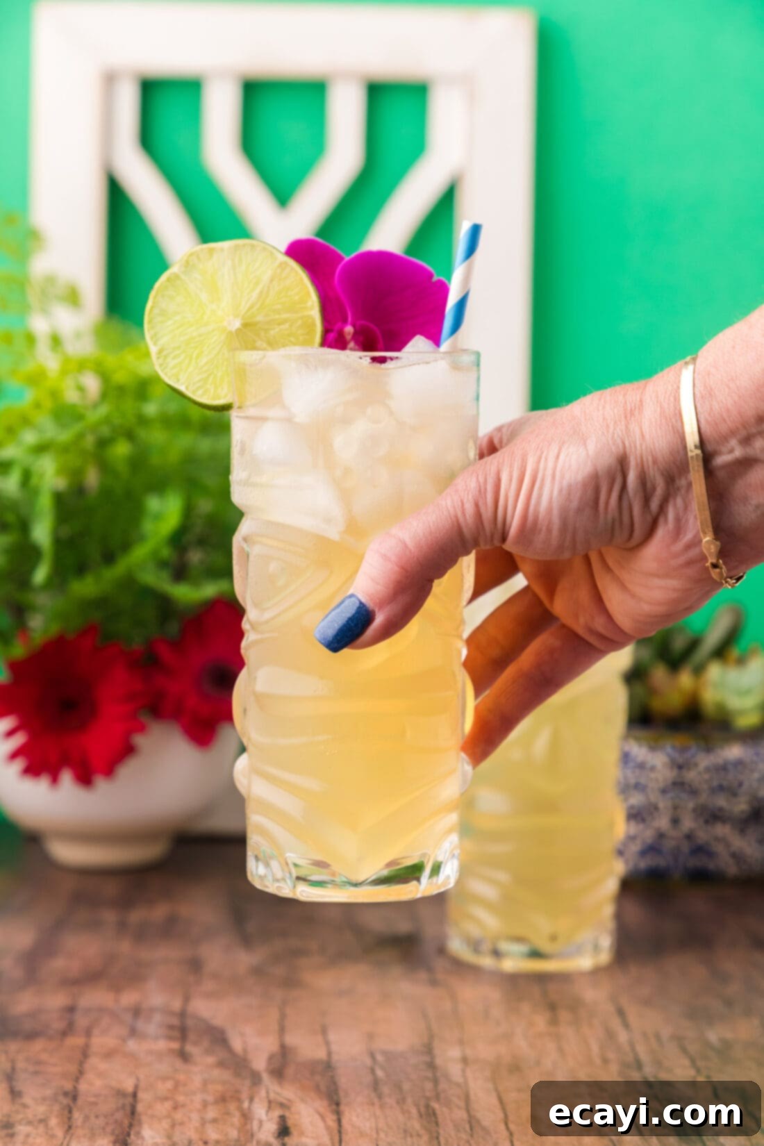 The Kingston Mule 3 Hand holding a Jamaican Mule in the air