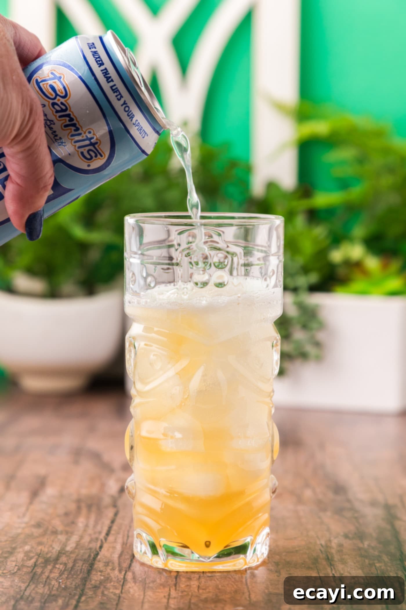 The Kingston Mule 8 pouring ginger beer over rum and lime juice