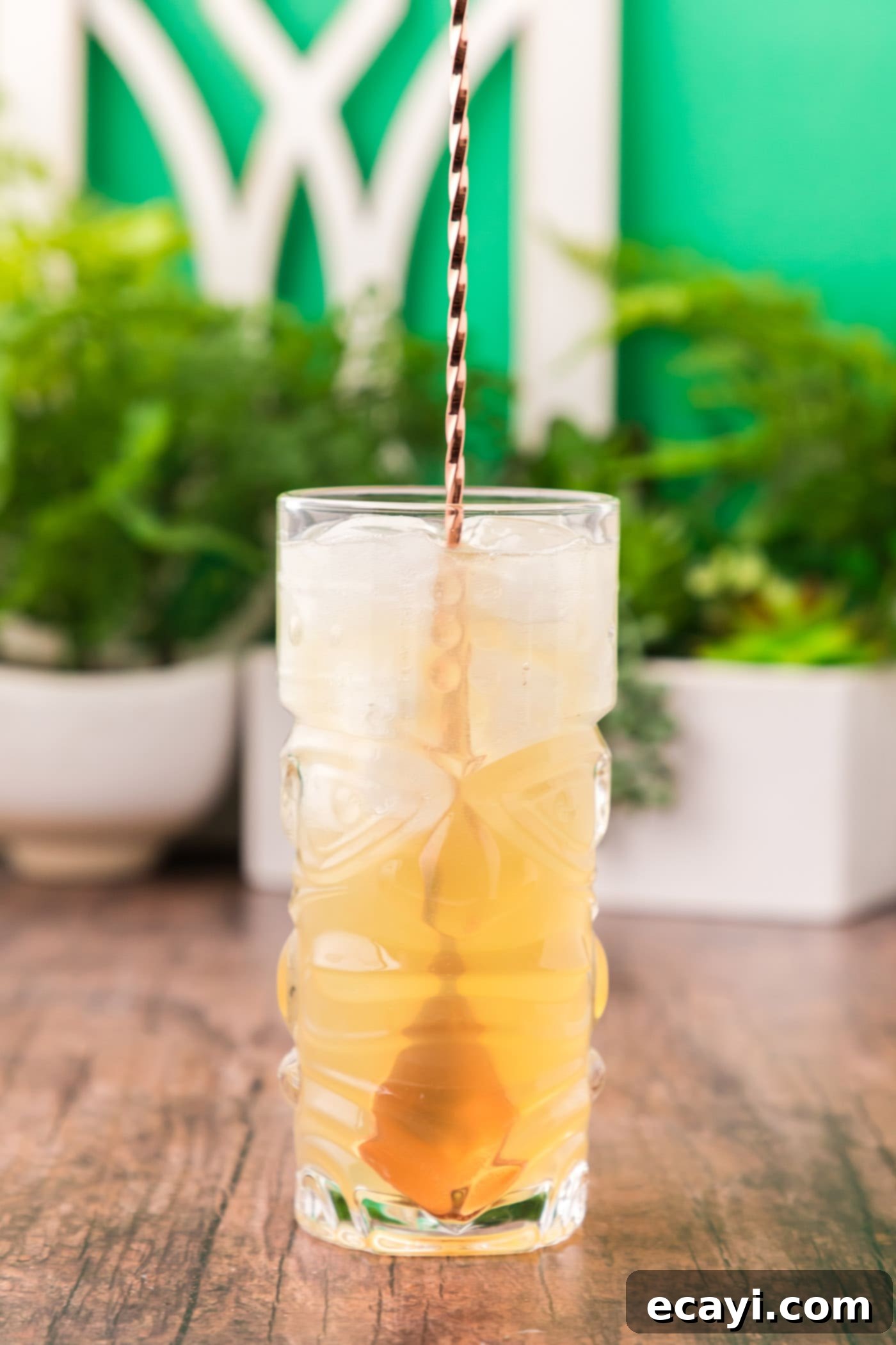 The Kingston Mule 9 cocktail spoon stirring jamaican rum cocktail
