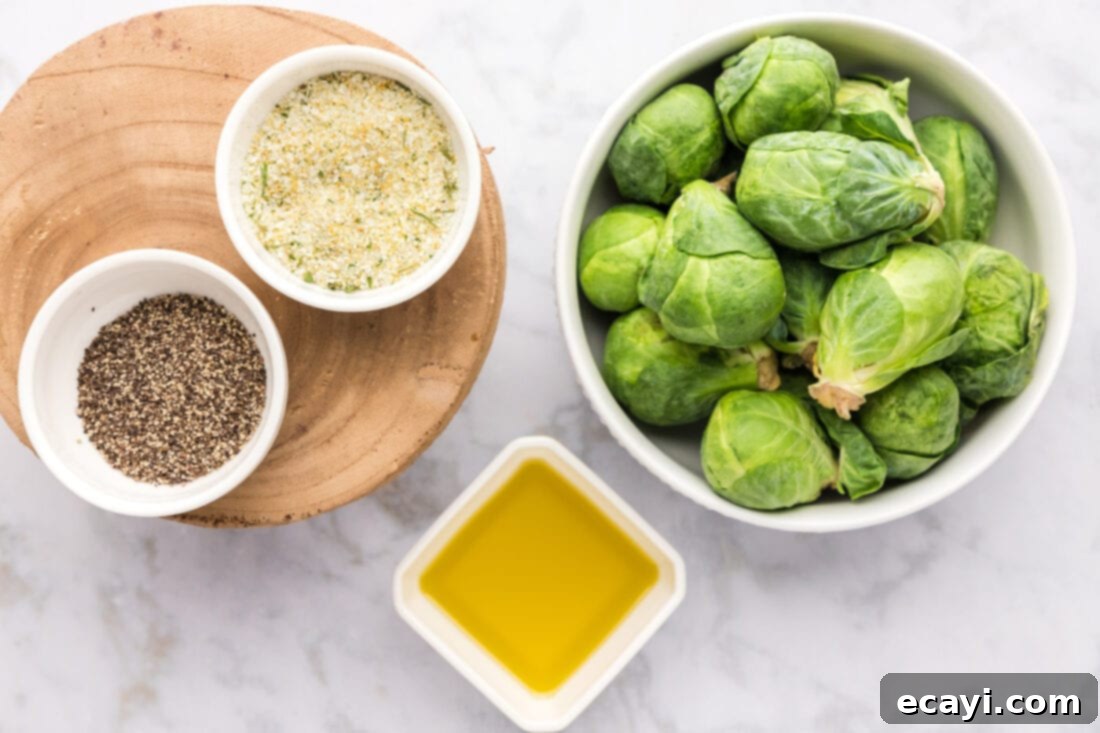 Crispy Roasted Brussels Sprouts 4 Ingredients for Roasted Brussel Sprouts laid out on a counter