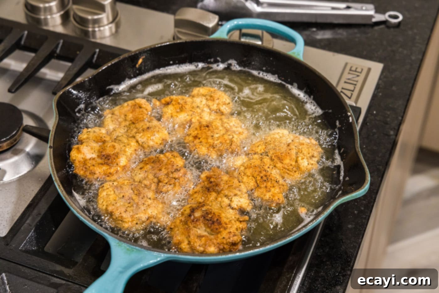 Southern Comfort Bliss 15 Multiple fried chicken thighs cooking in a skillet