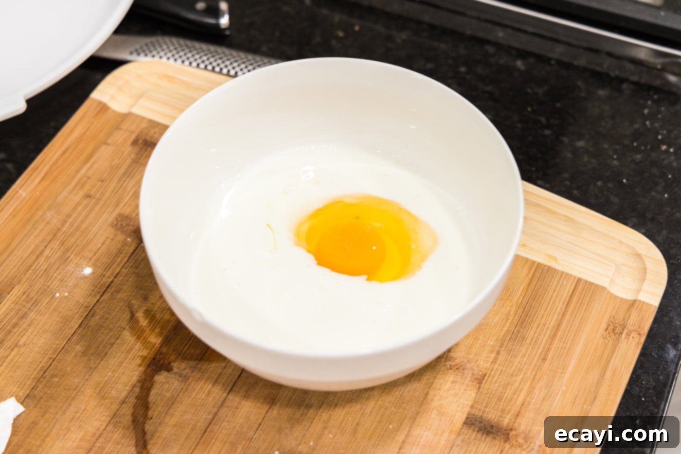 Southern Comfort Bliss 5 Egg and buttermilk being whisked together in a bowl