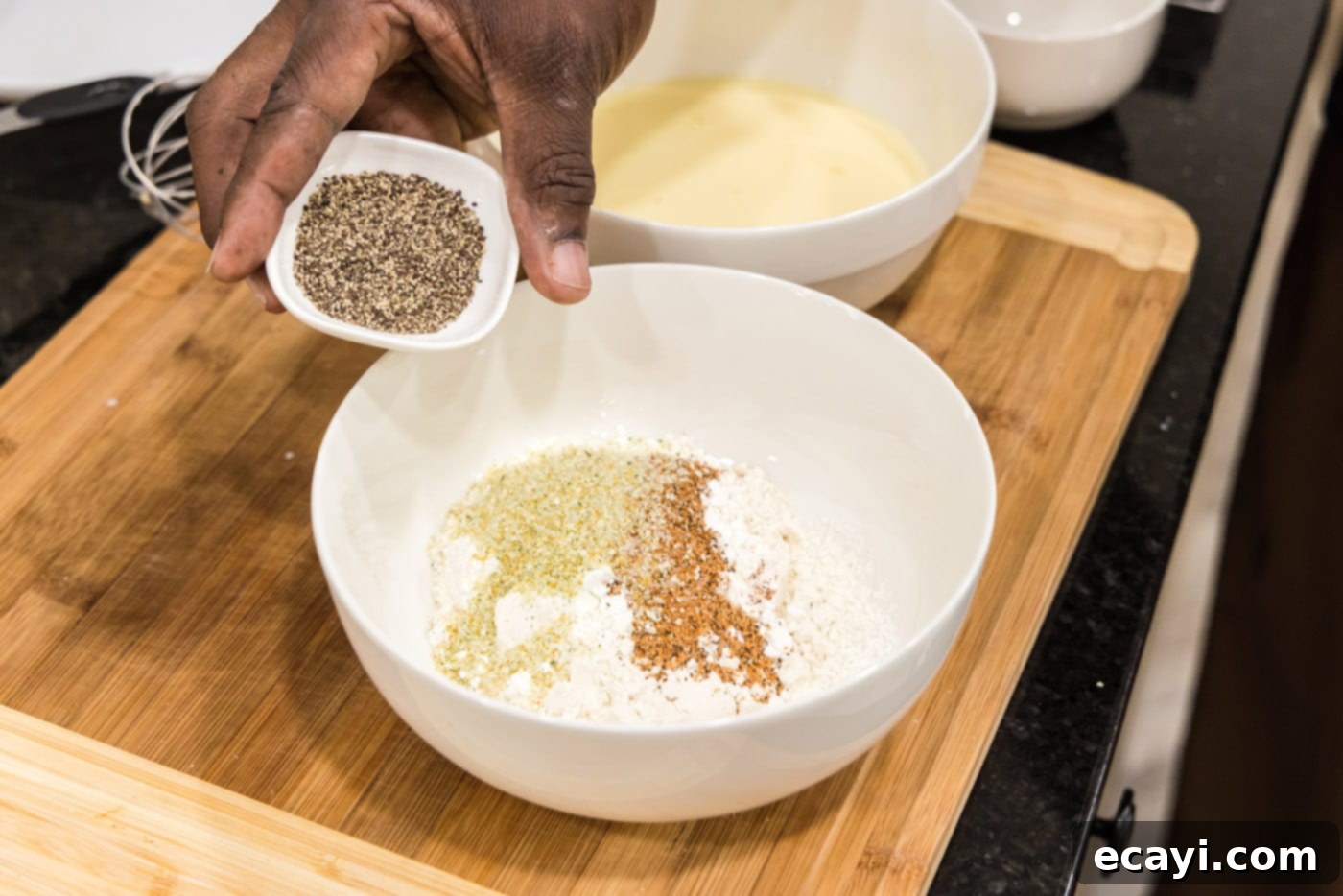 Southern Comfort Bliss 6 Adding black pepper to the flour mixture