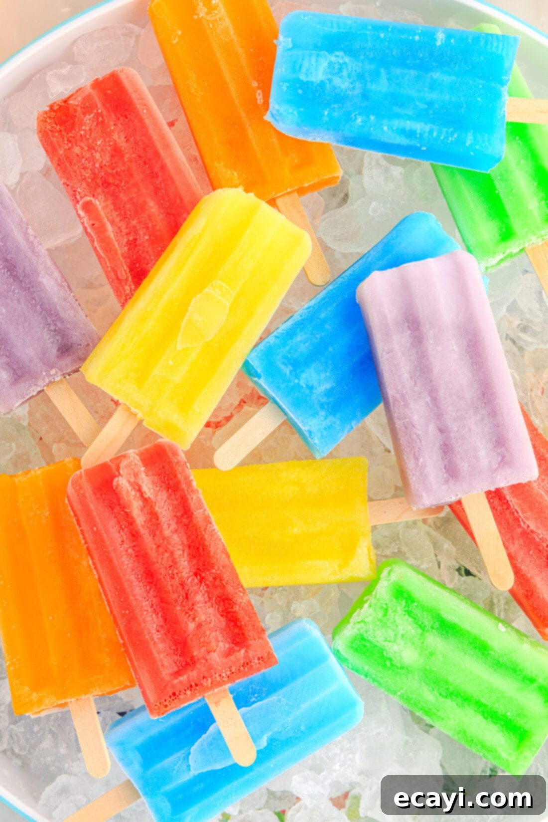 Colorful Gelatin Ice Pops 2 Close up photo of an assortment of Jello Popsicles resting over a bowl of ice