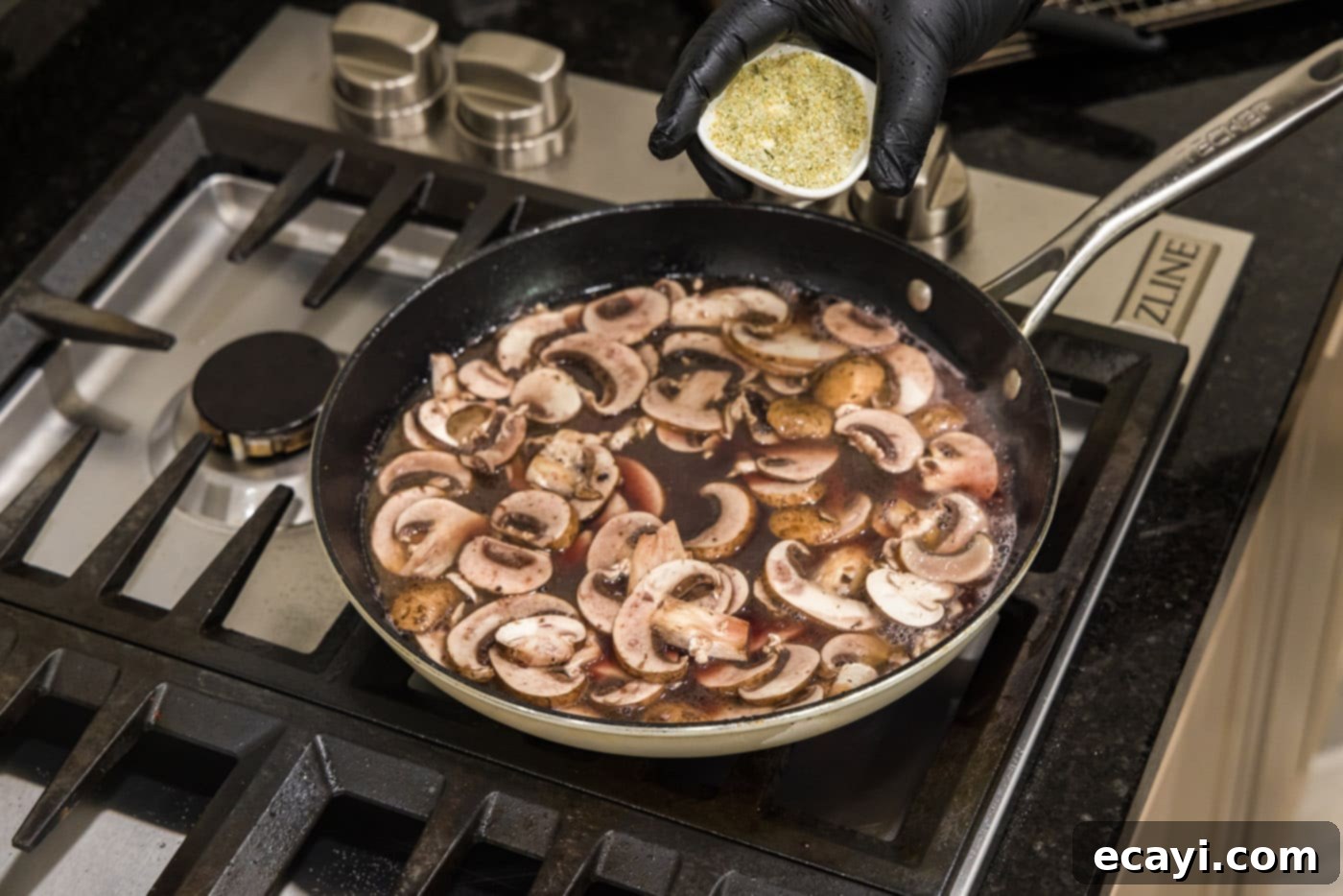 Classic Veal Marsala 11 Slicing fresh mushrooms directly into the simmering Marsala sauce.