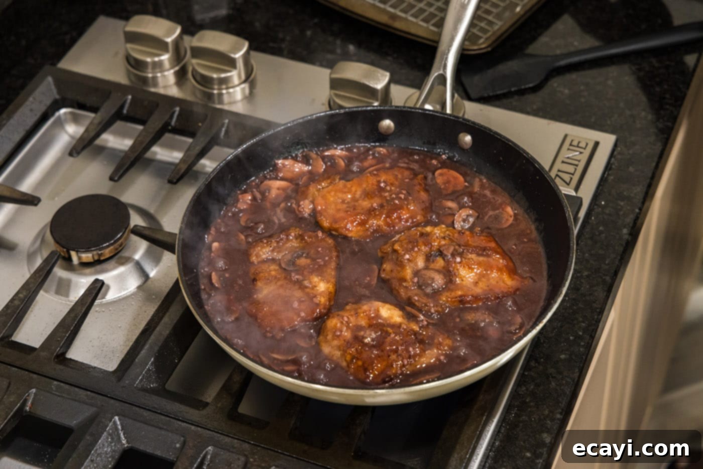 Classic Veal Marsala 14 Veal Marsala cutlets coated in sauce, simmering in a skillet, ready to be served.