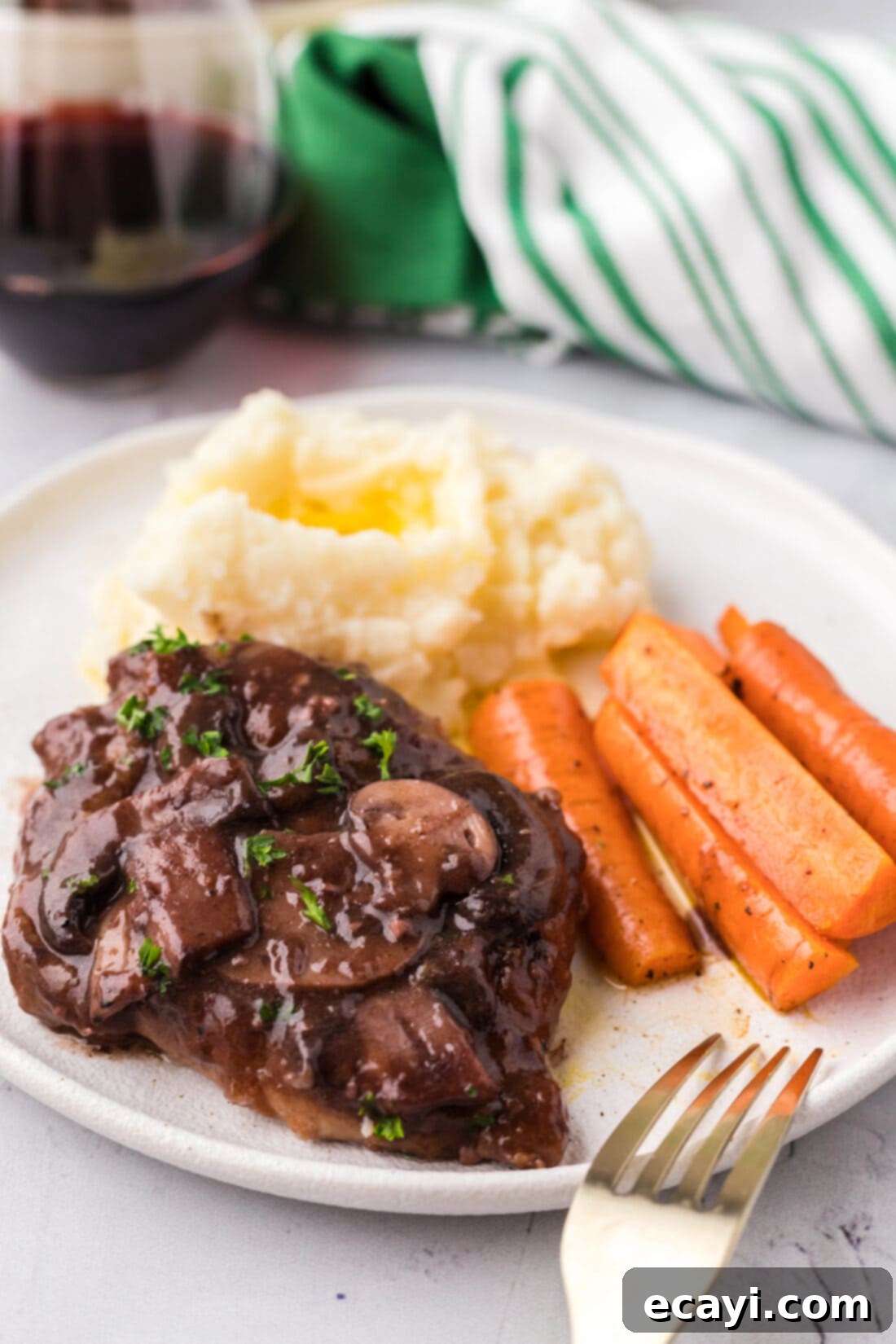 Classic Veal Marsala 3 Plated Veal Marsala with a side of carrots and creamy mashed potatoes, showcasing a perfect dinner.