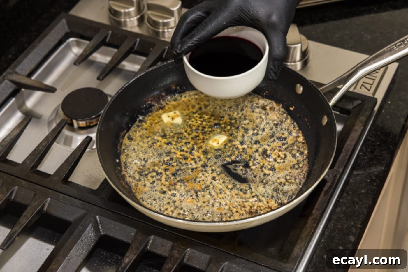 Classic Veal Marsala 10 Adding Marsala wine to the butter and garlic sizzling in the skillet.