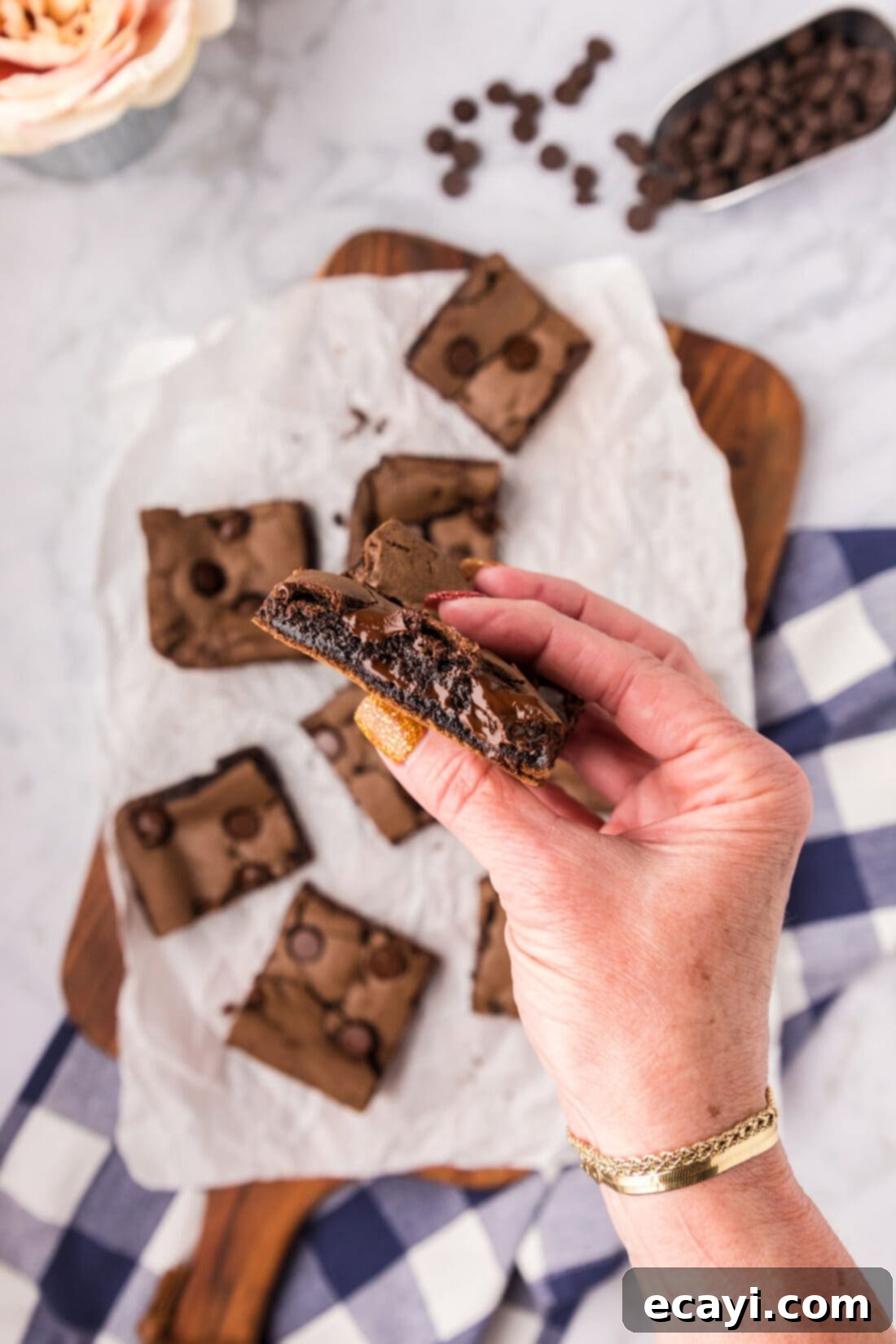 Foolproof Cake Mix Brownies 15 Hand holding half of a rich, fudgy Cake Mix Brownie, showing its dense texture