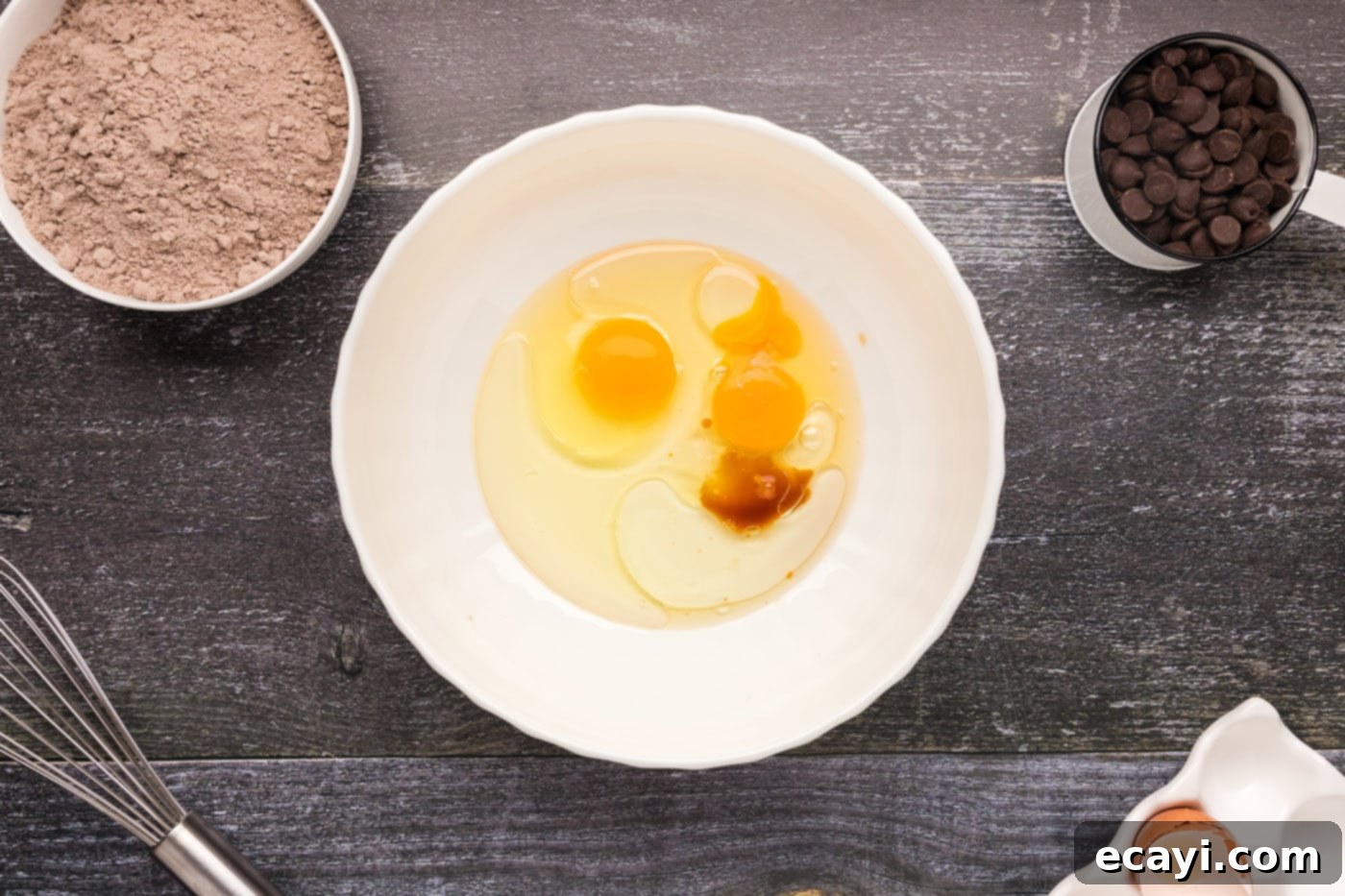 Foolproof Cake Mix Brownies 5 eggs, oil, and vanilla in a bowl, before whisking