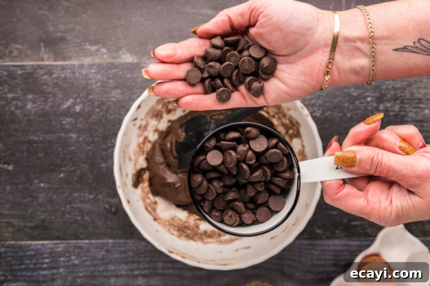 Foolproof Cake Mix Brownies 9 adding dark chocolate chips to the brownie batter in the bowl