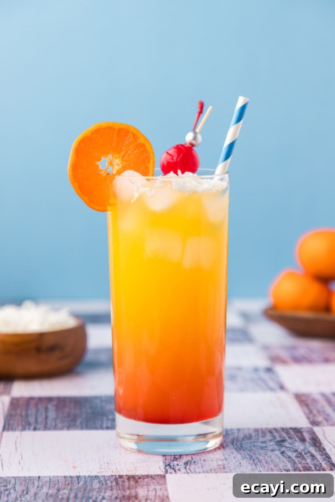 Coastal Awakening 2 Malibu Sunrise garnished with an orange wheel and cherry
