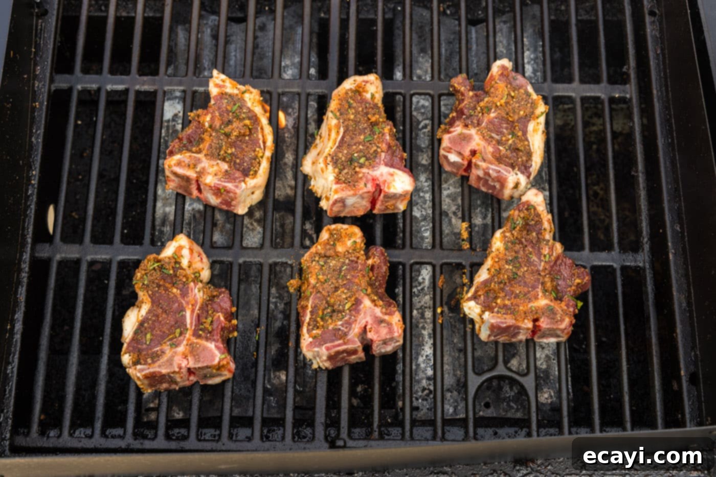 Succulent Grilled Lamb Loin 9 Seasoned lamb loin chops sizzling on a hot grill, creating tantalizing grill marks