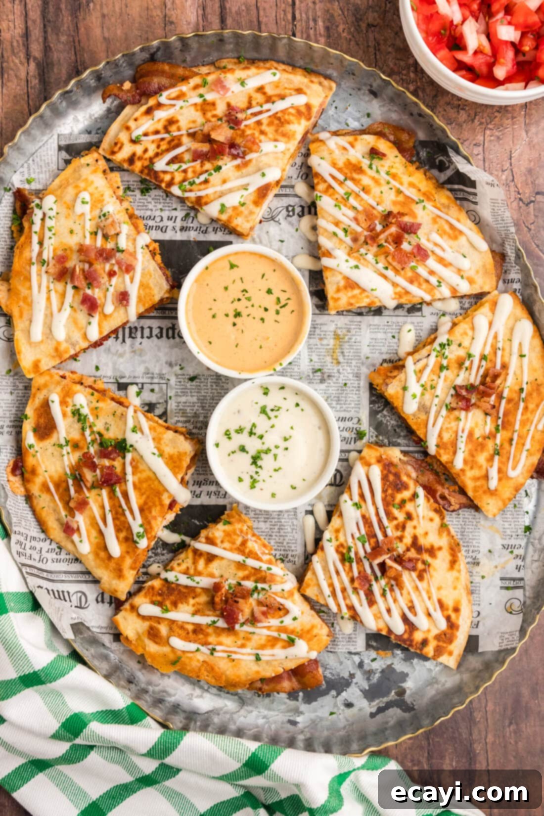 Ultimate Chicken Bacon Ranch Quesadillas 5 A beautiful platter showcasing perfectly cut Chicken Bacon Ranch Quesadilla triangles, garnished and ready for serving.