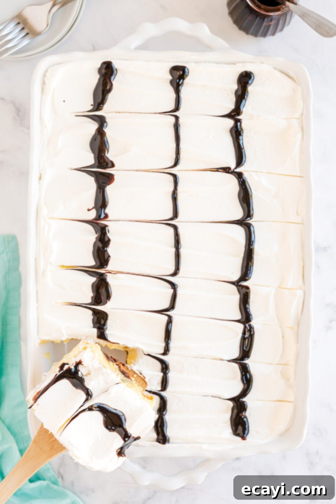 Ultimate Chocolate Eclair Puff Cake 12 over head view of pan of Cream Puff Chocolate Eclair Cake